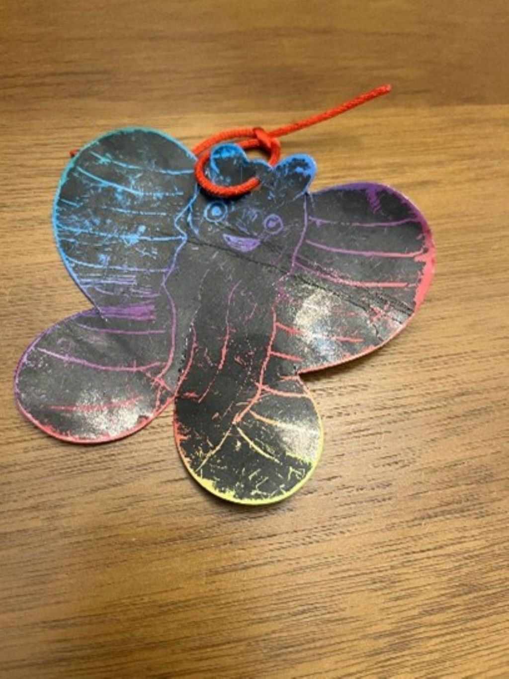 Small black butterfly given as a thank-you gift from a child.